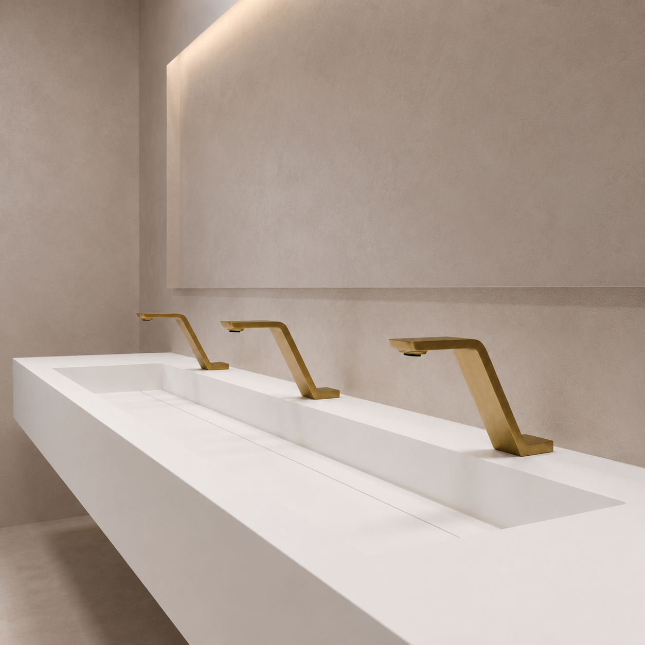 Large public restroom sink bank with sensor-operated faucets in a government or healthcare building